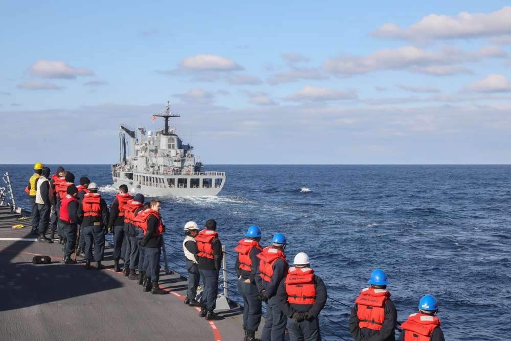 Sailors aboard the USS Rafael Peralta (DDG 115) prepare to conduct a replenishment-at-sea with the Republic of Korea’s combat support ship Dae Cheong (AOE 58)