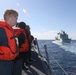 Sailors aboard the USS Rafael Peralta (DDG 115) conduct a replenishment-at-sea with Royal Canadian Navy supply ship MV Asterix in the Sea of Japan