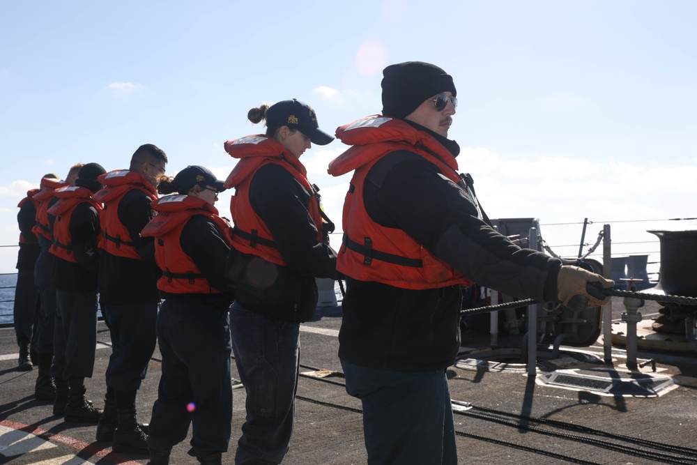Sailors aboard the USS Rafael Peralta (DDG 115) conduct a replenishment-at-sea with Royal Canadian Navy supply ship MV Asterix in the Sea of Japan