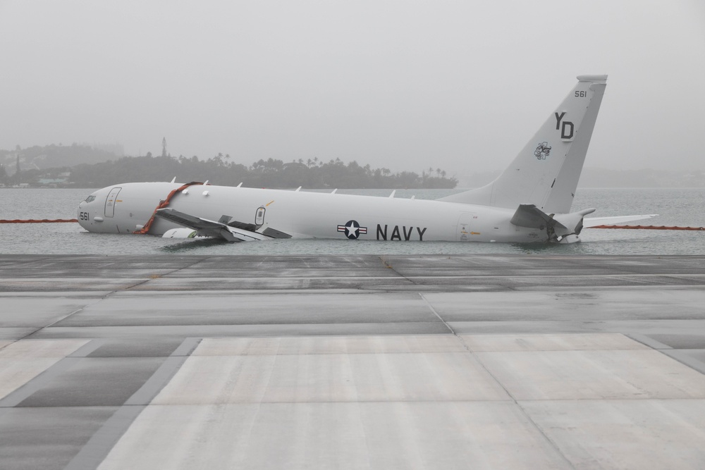 Navy deploys environmental containment booms around downed P-8A Poseidon