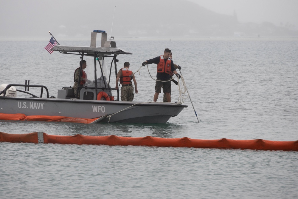 Navy deploys environmental containment booms around downed P-8A Poseidon