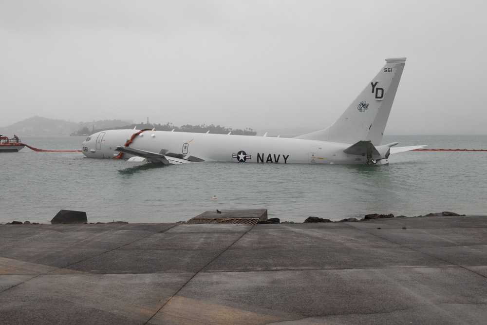 Navy deploys environmental containment booms around downed P-8A Poseidon