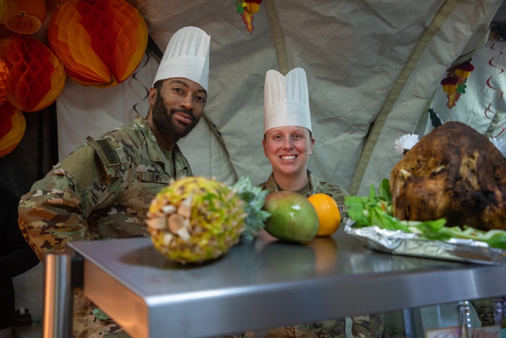 US Powidz Soldiers enjoy a Thanksgiving meal in Poland