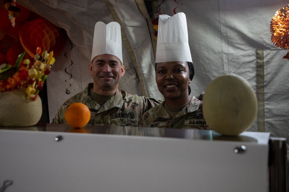 US Powidz Soldiers enjoy a Thanksgiving meal in Poland