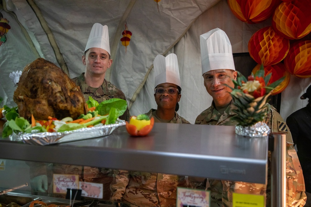 US Powidz Soldiers enjoy a Thanksgiving meal in Poland