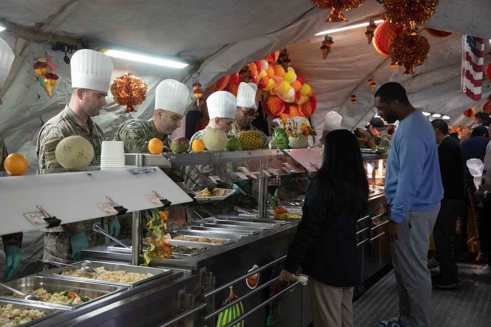 US Powidz Soldiers enjoy a Thanksgiving meal in Poland