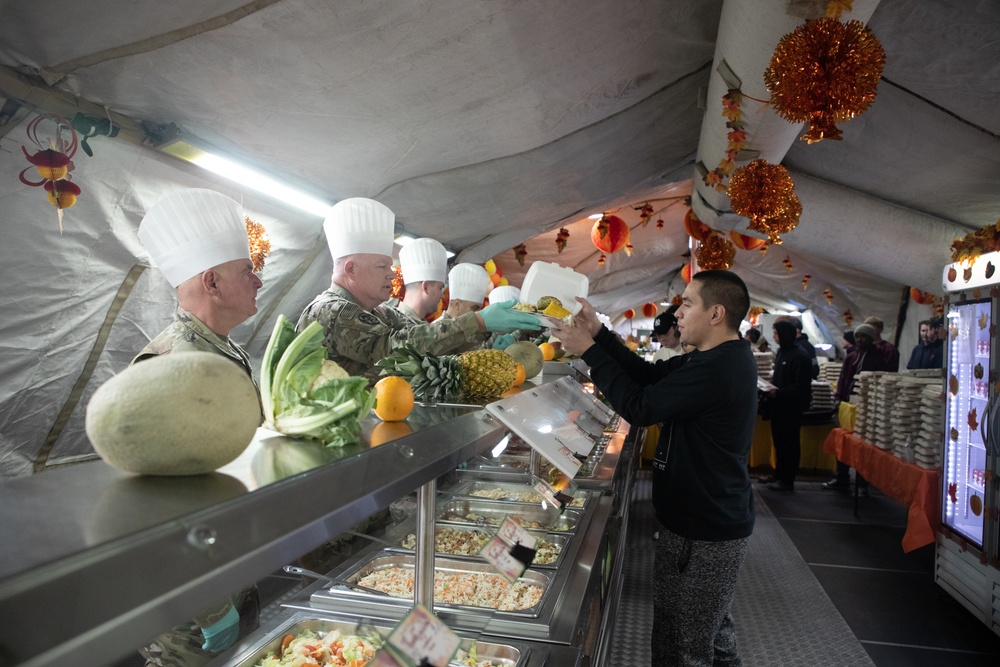 US Powidz Soldiers enjoy a Thanksgiving meal in Poland