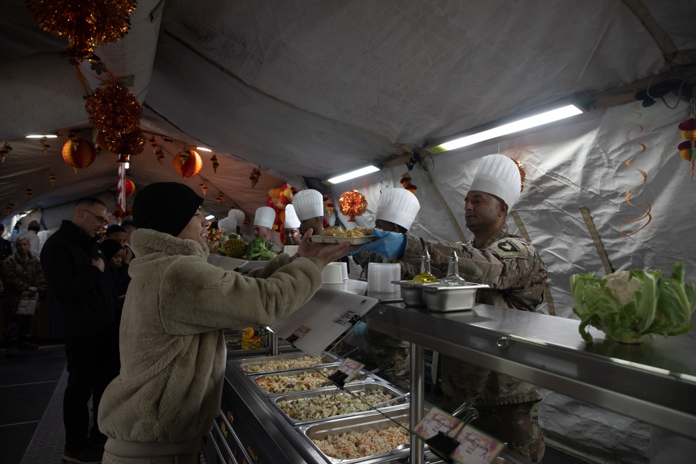 US Powidz Soldiers enjoy a Thanksgiving meal in Poland