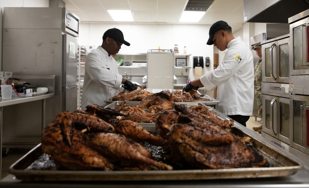 Fort Carson Soldier Cook Thanksgiving Dinner for Families in Need.