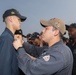 Sailors aboard the USS Rafael Peralta (DDG 115) hold a frocking ceremony in the East China Sea
