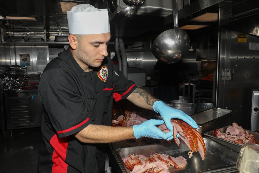 Sailors aboard the USS Rafael Peralta (DDG 115) hold a Thanksgiving dinner in the East China Sea
