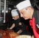 Sailors aboard the USS Rafael Peralta (DDG 115) hold a Thanksgiving dinner in the East China Sea