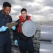 Sailors aboard the USS Rafael Peralta (DDG 115) conduct routine maintenance in the East China Sea