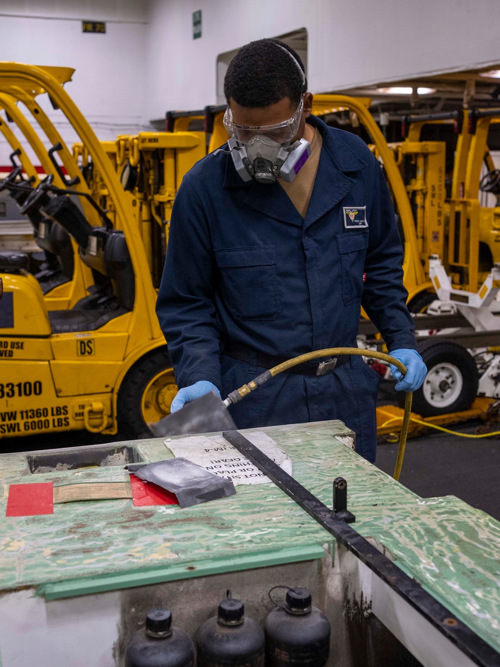 USS Carl Vinson (CVN 70) Sailor Conducts Preventative Maintenance