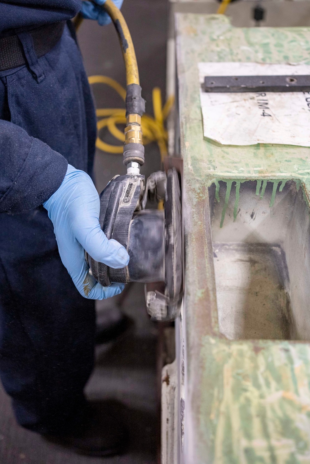 USS Carl Vinson (CVN 70) Sailor Conducts Preventative Maintenance