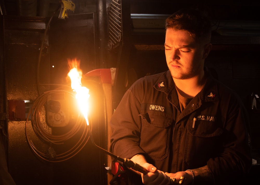 USS Ronald Reagan (CVN 76) Sailors practice welding