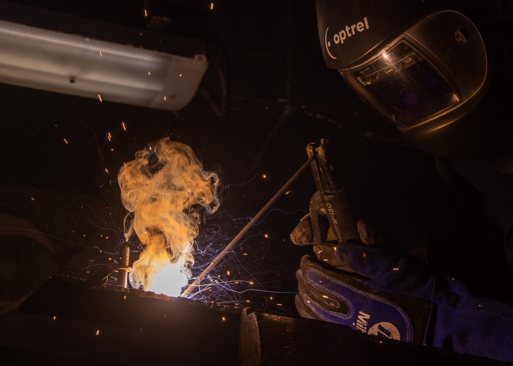 USS Ronald Reagan (CVN 76) Sailors practice welding