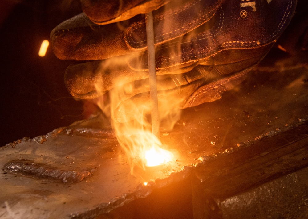 USS Ronald Reagan (CVN 76) Sailors practice welding