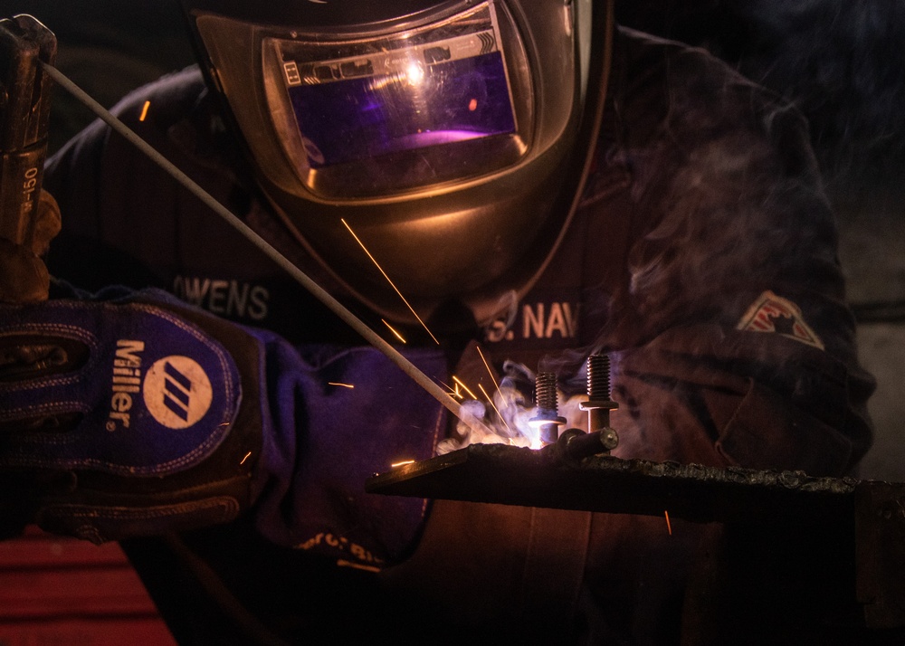 USS Ronald Reagan (CVN 76) Sailors practice welding