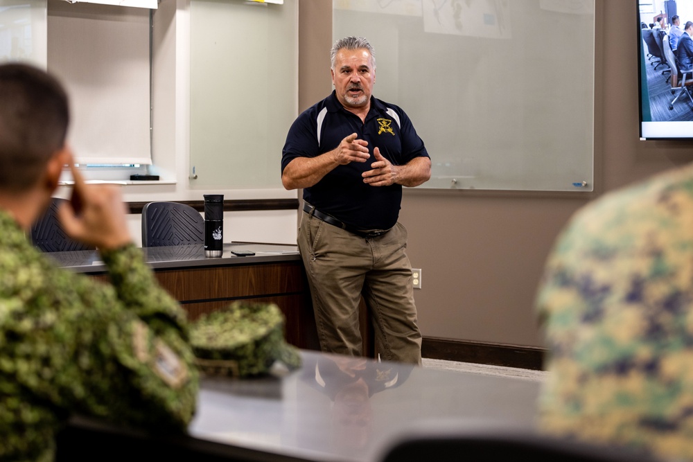 A Colombian marine corps delegation visits the Naval Small Craft Instruction and Technical Training School