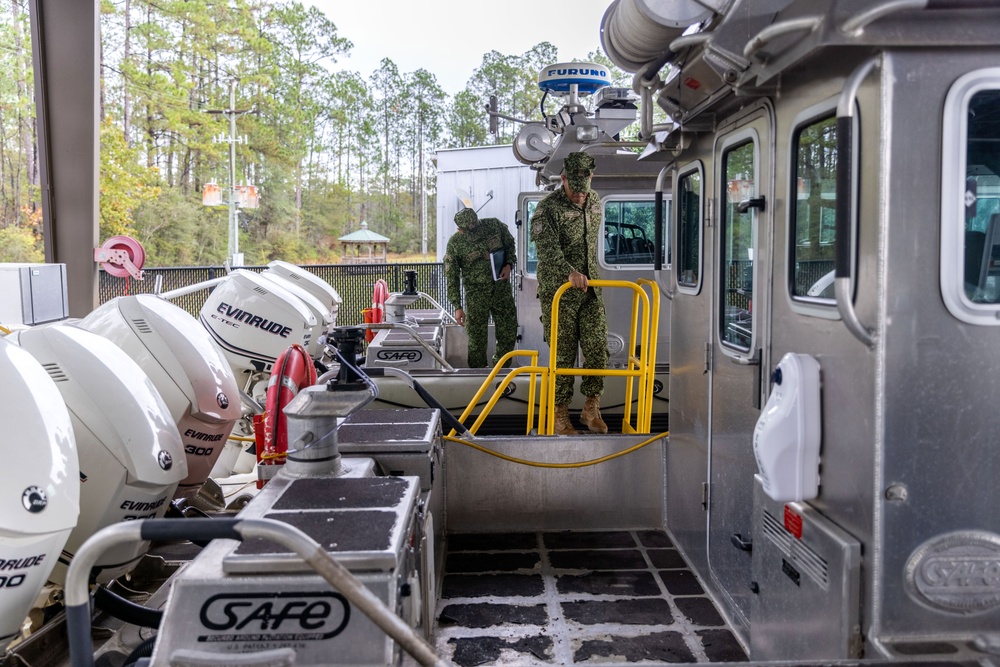 A Colombian marine corps delegation visits the Naval Small Craft Instruction and Technical Training School