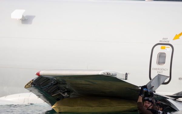 Defueling Operations are conducted on downed U.S. Navy P-8A Poseidon