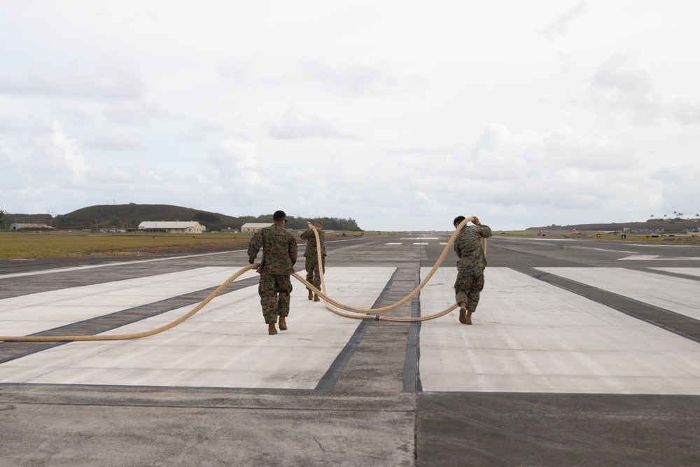 Defueling Operations are conducted on downed U.S. Navy P-8A Poseidon