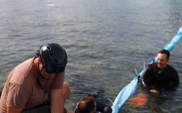 Defueling Operations are conducted on downed U.S. Navy P-8A Poseidon