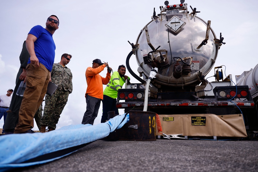 Defueling Operations are conducted on downed U.S. Navy P-8A Poseidon