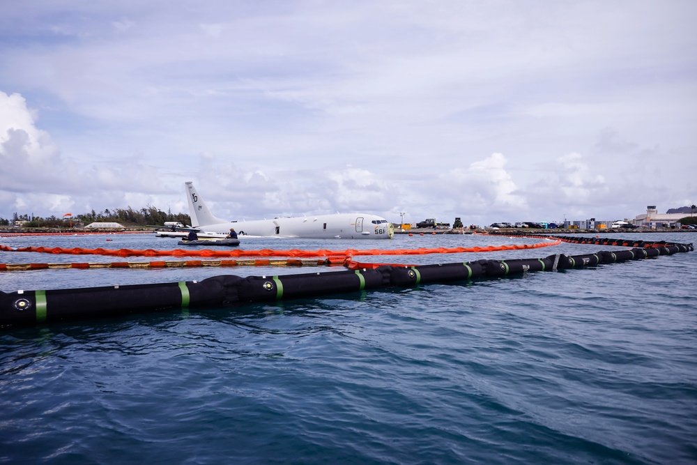 Defueling Operations are conducted on downed U.S. Navy P-8A Poseidon