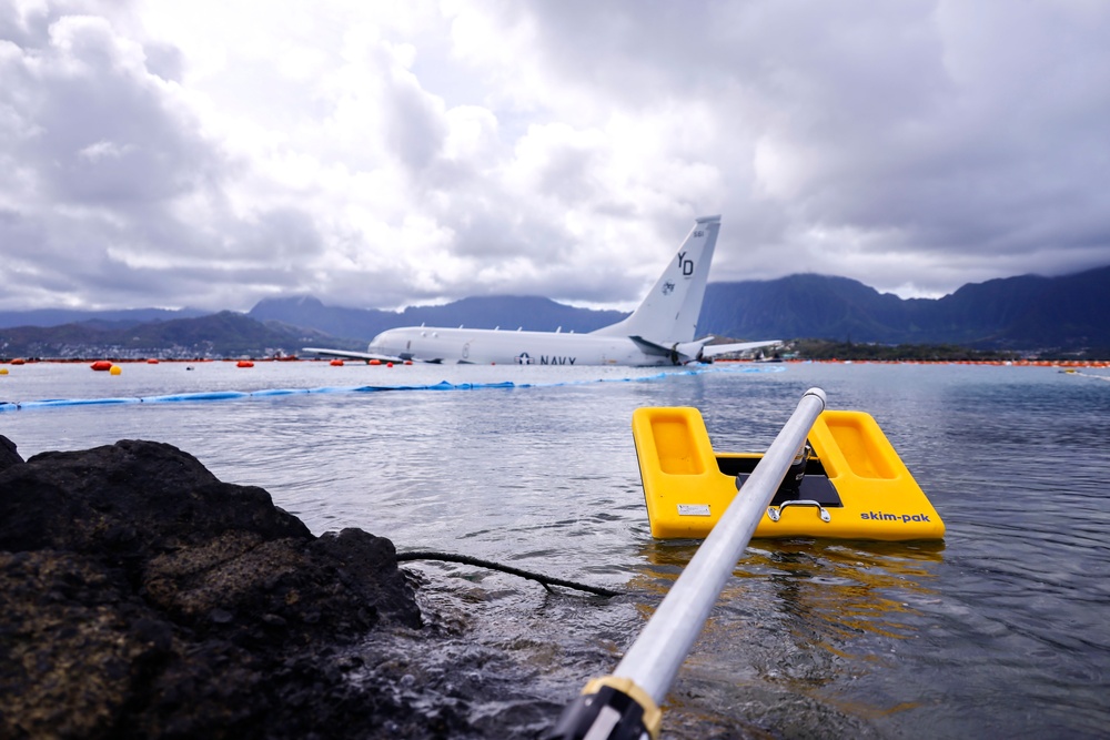 Defueling Operations are conducted on downed U.S. Navy P-8A Poseidon