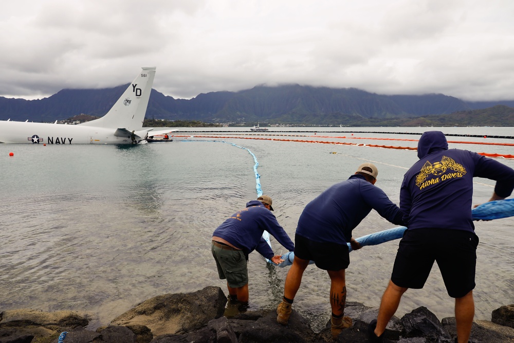 Defueling Operations are conducted on downed U.S. Navy P-8A Poseidon