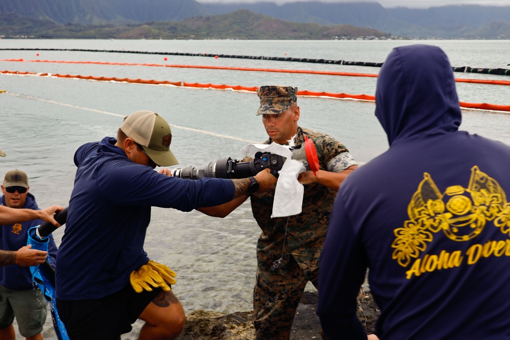 Defueling Operations are conducted on downed U.S. Navy P-8A Poseidon