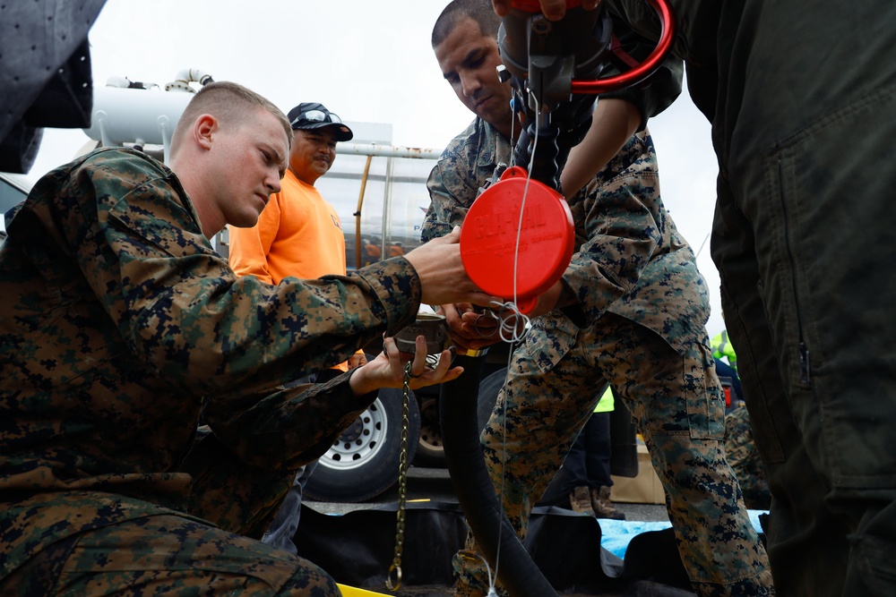 Defueling Operations are conducted on downed U.S. Navy P-8A Poseidon