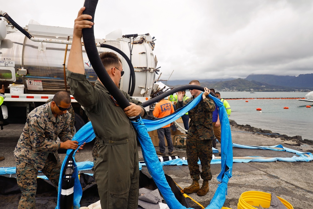 Defueling Operations are conducted on downed U.S. Navy P-8A Poseidon