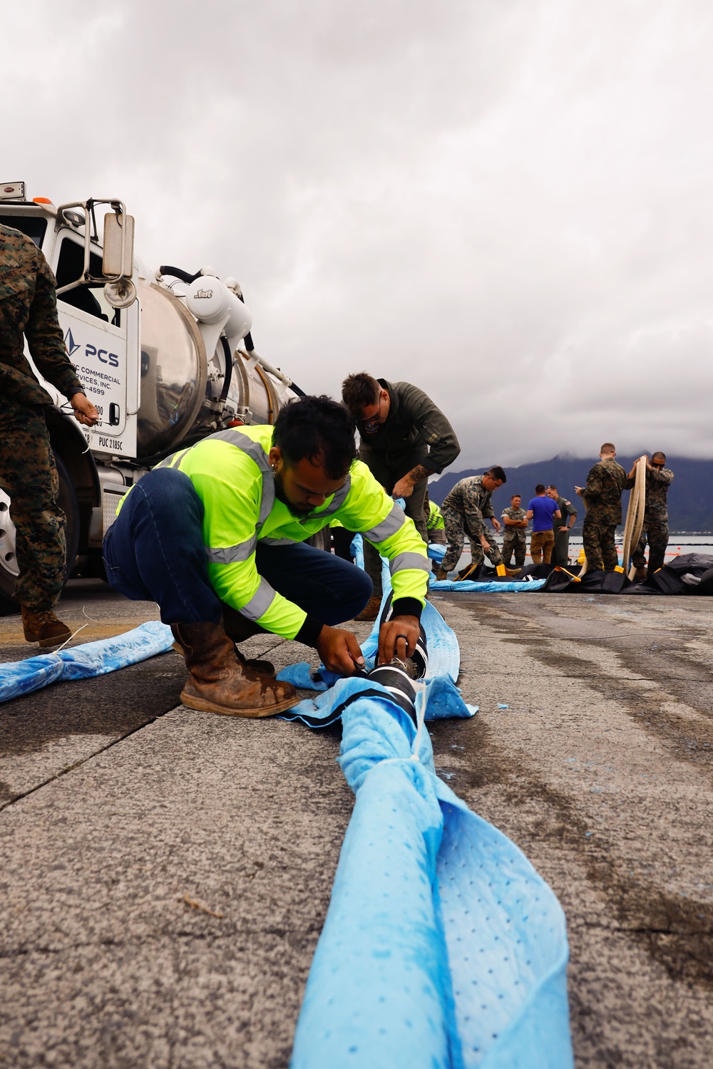 Defueling Operations are conducted on downed U.S. Navy P-8A Poseidon