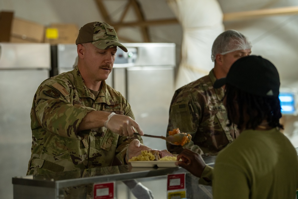 Service members share Thanksgiving meal down range