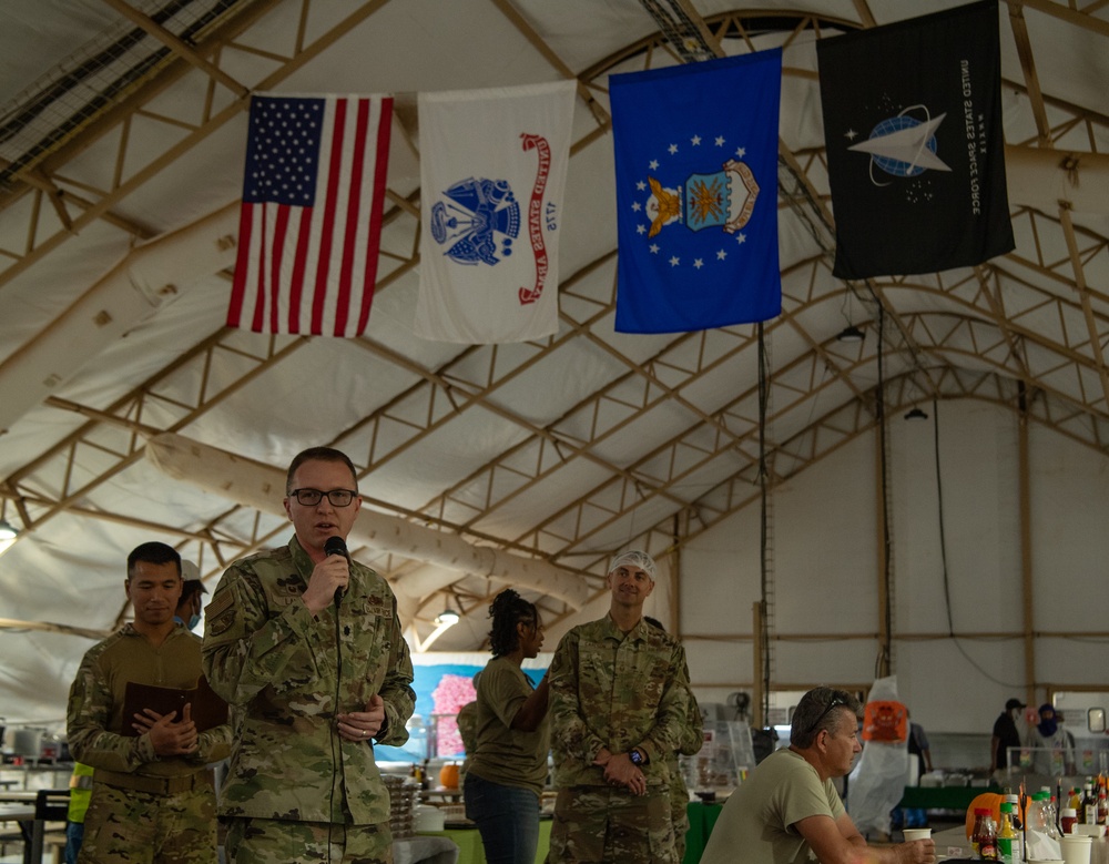 Service members share Thanksgiving meal down range