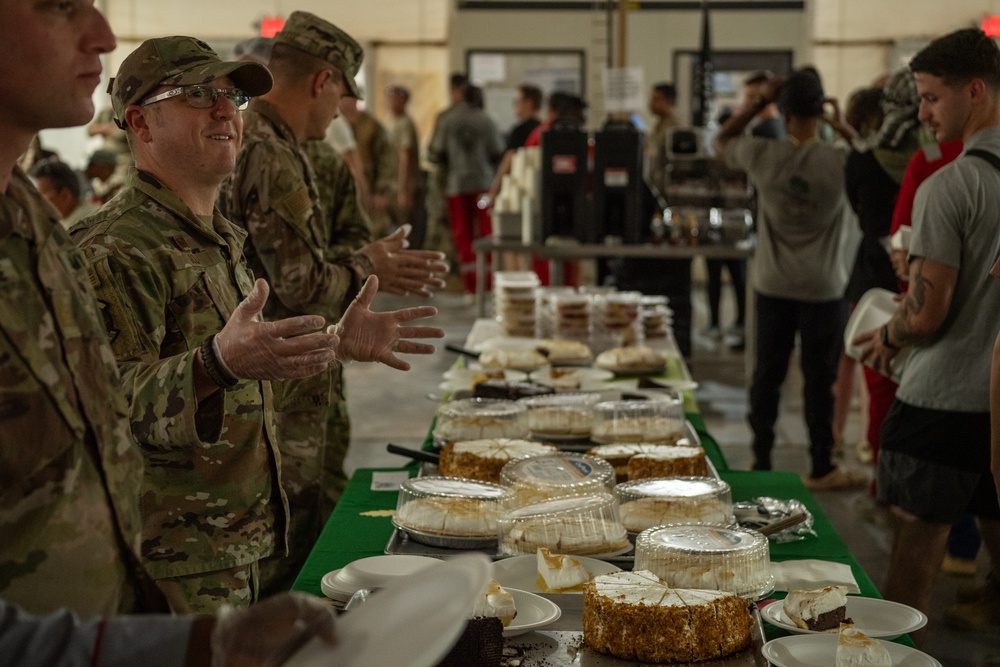 Service members share Thanksgiving meal down range