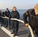 Sailors aboard the USS Rafael Peralta (DDG 115) conduct sea and anchor detail in Yokosuka, Japan