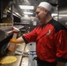 Sailors aboard the USS Rafael Peralta (DDG 115) prepare breakfast for the crew in the Taiwan Strait