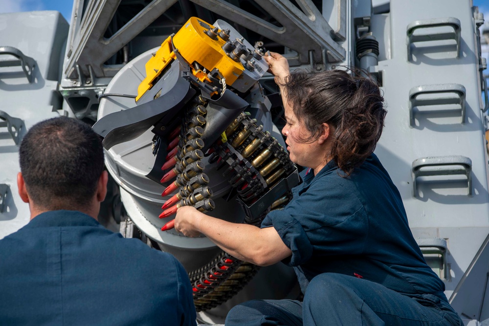 USS Kidd (DDG 100) Sailor Loads Close-In Weapons System (CIWS)