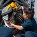 USS Kidd (DDG 100) Sailor Loads Close-In Weapons System (CIWS)