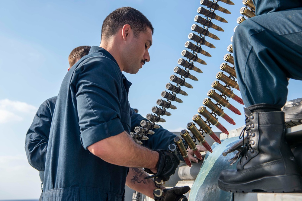 USS Kidd (DDG 100) Sailor Loads Close-In Weapons System (CIWS)