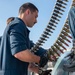 USS Kidd (DDG 100) Sailor Loads Close-In Weapons System (CIWS)