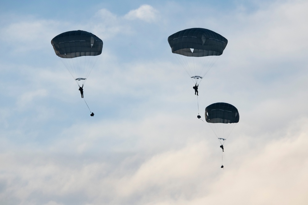 Air Force special warfare Airmen, Alaska Air National Guard aviators, and Army paratroopers conduct airborne training at JBER