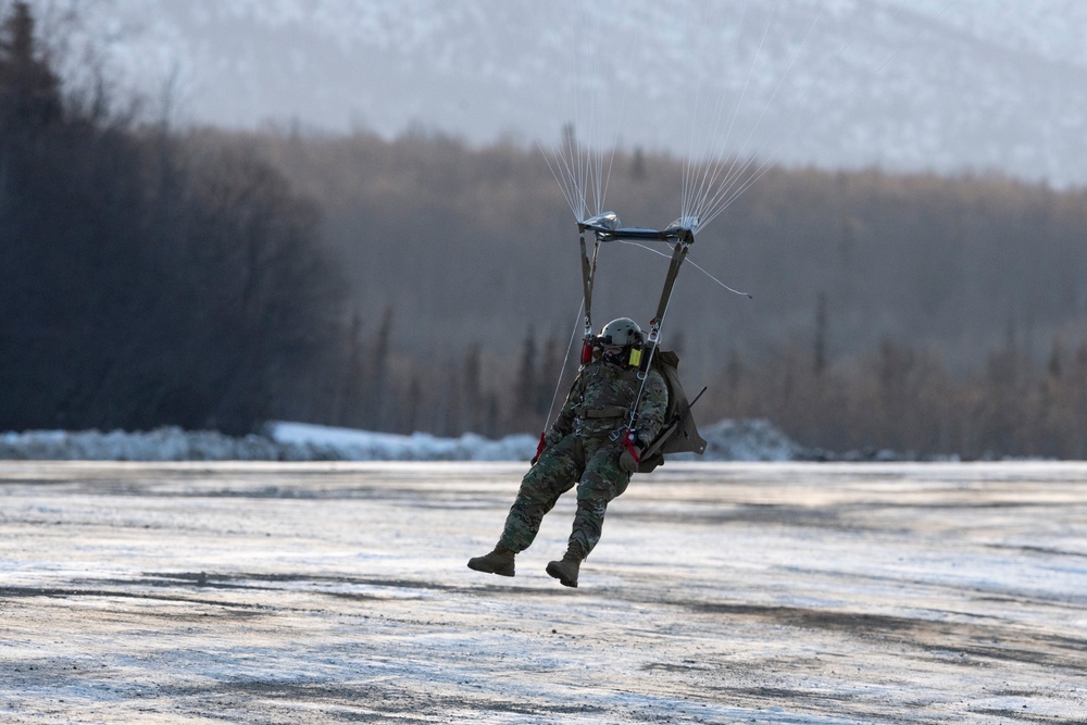 Air Force special warfare Airmen, Alaska Air National Guard aviators, and Army paratroopers conduct airborne training at JBER