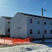 Contractors finish moving World War II-era barracks buildings to new foundations at Fort McCoy