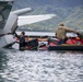 Experts prepare a U.S. Navy P-8A Poseidon in Kaneohe Bay for Salvage Operations