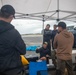 Experts prepare a U.S. Navy P-8A Poseidon in Kaneohe Bay for Salvage Operations